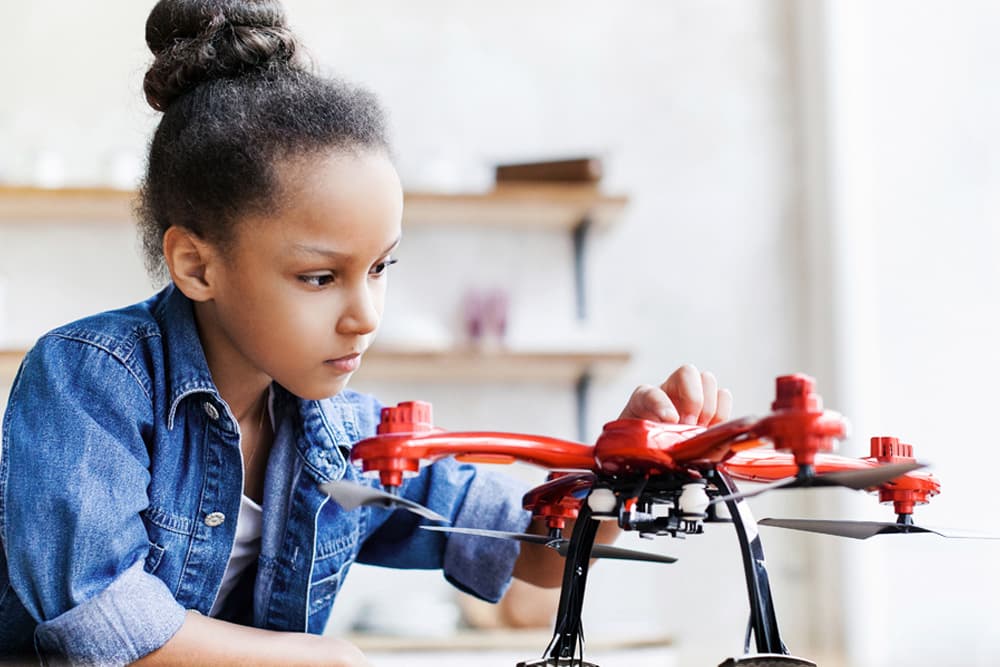 child working on a drone in stem program nurturing aspirations in young people