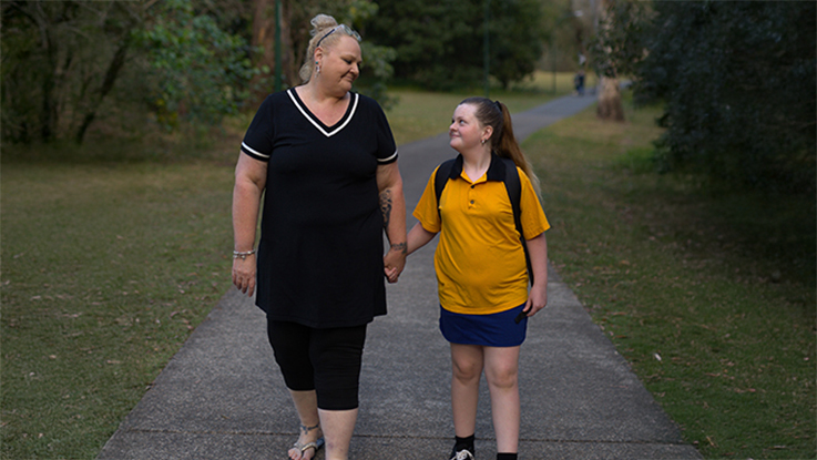 Mother and daughter walking