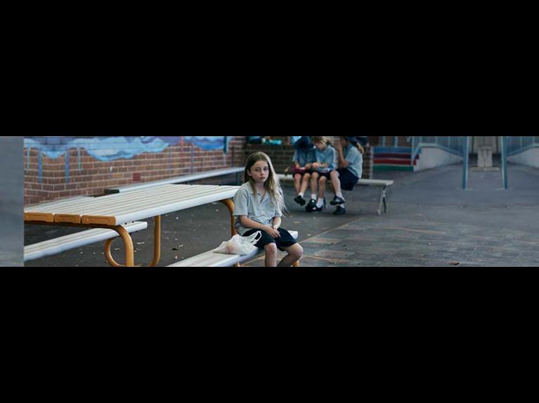 jess sits at the school lunch table with a plastic bag and little lunch