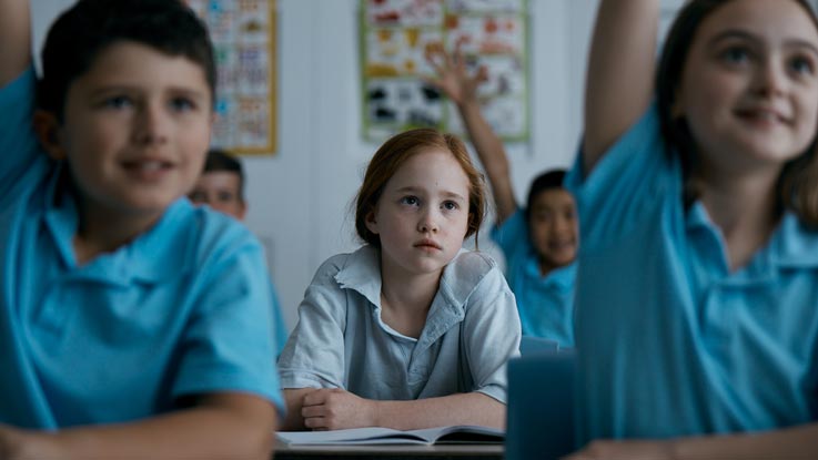 Amy looking despondent in classroom