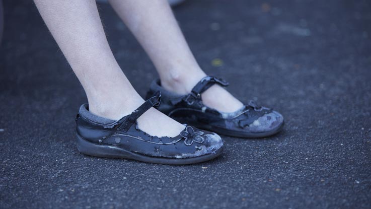 Worn out girl's shoes