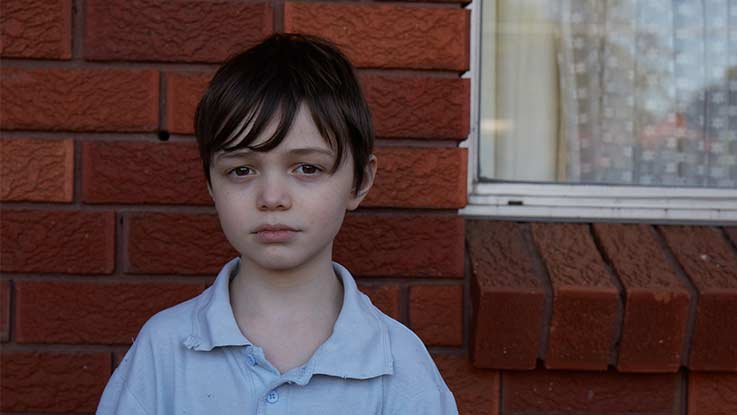 Close-up of Billy looking sad