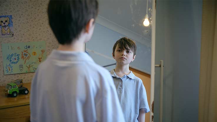 Billy looking in mirror