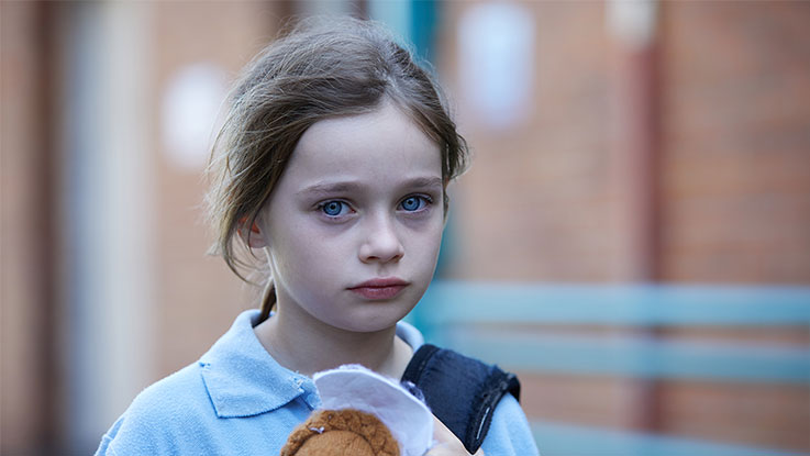 Sarah alone in playground