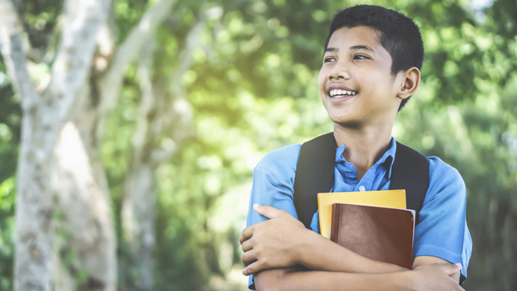 High School student holding a book