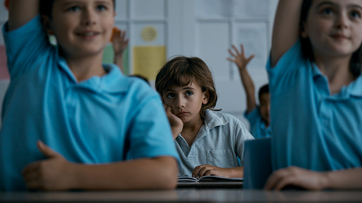 Zack with peers in classroom