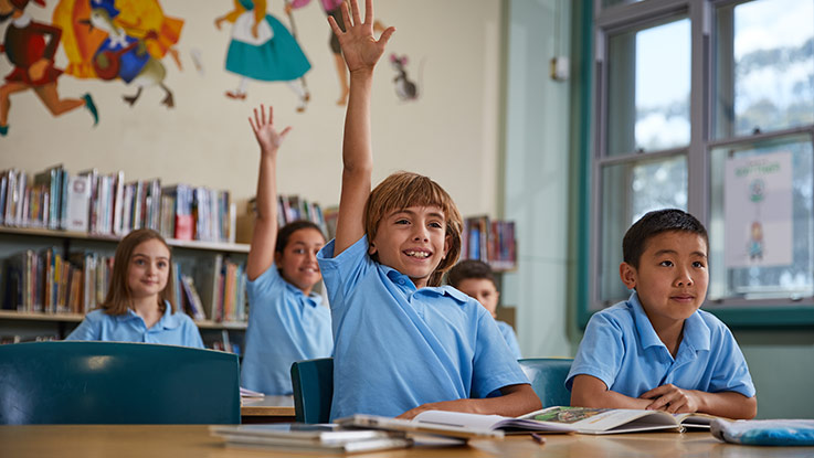 Zack participating happily in classroom