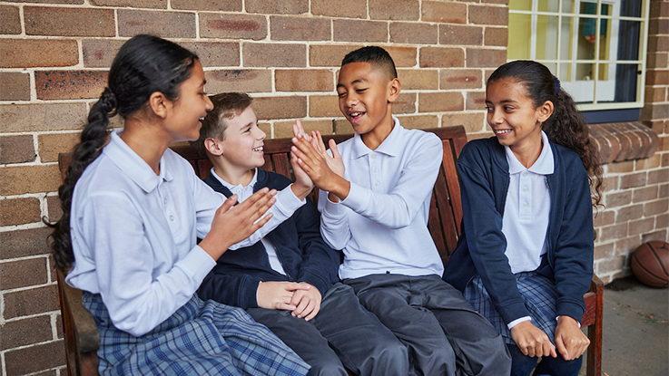 a group of primary school students laughing together