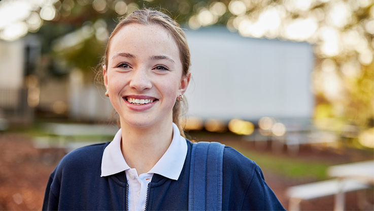 a high school girl smiling