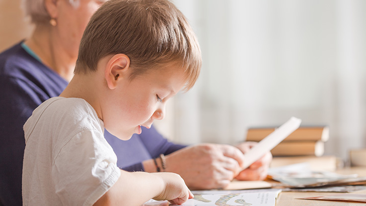 early years student learning how to read