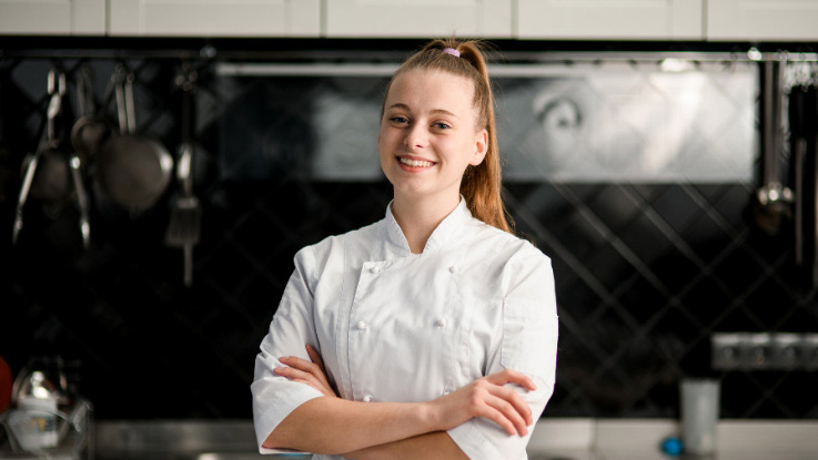 a young female chef in her chef clothes