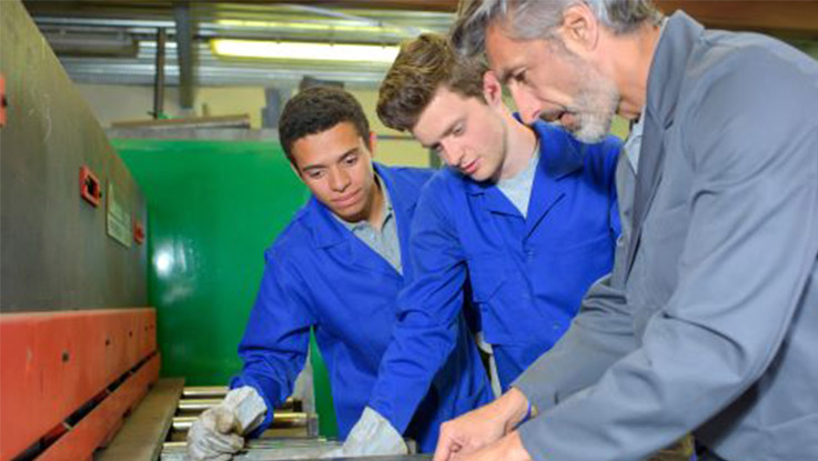 a group of students learning on a job through an apprenticeship