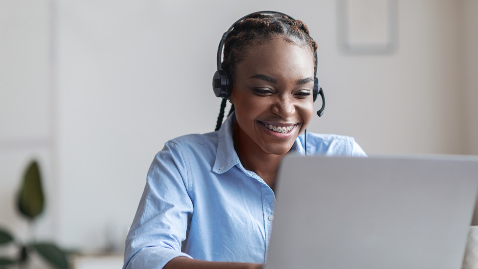woman looking at a laptop