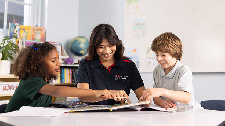 a smith family learning for life coordinator with students in a classroom