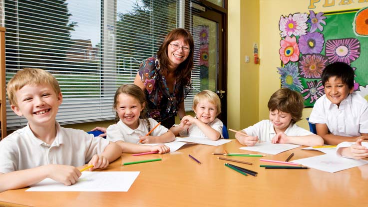 Group of children around a table