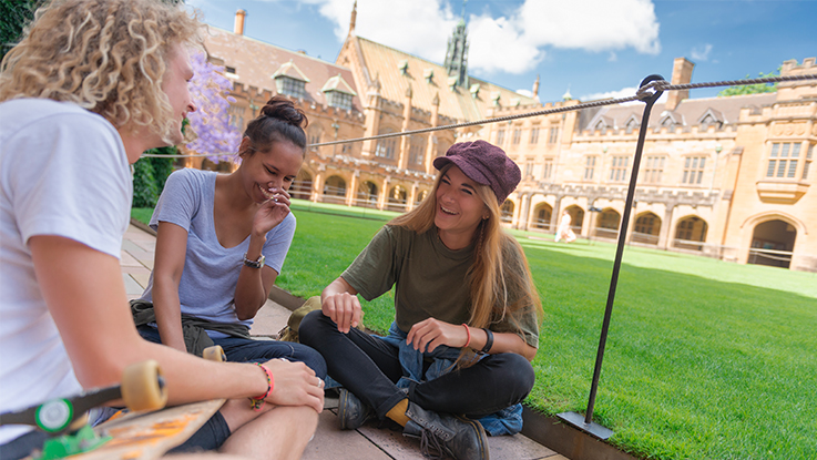 university students sitting on campus conversation