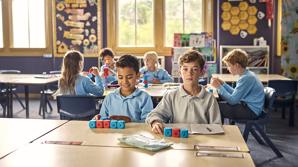 school students sitting in the classroom together