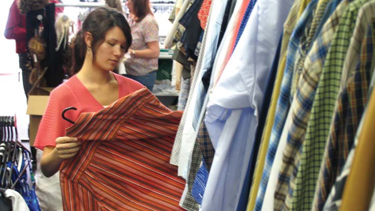Woman selecting a shirt