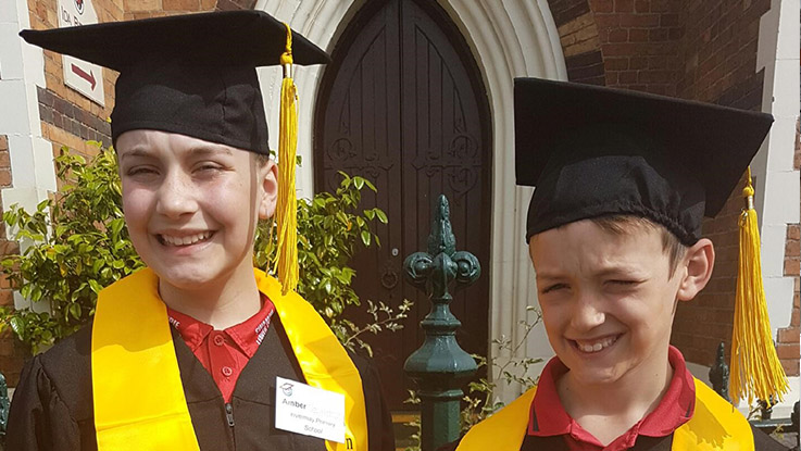 amber and aston at a graduation ceremony