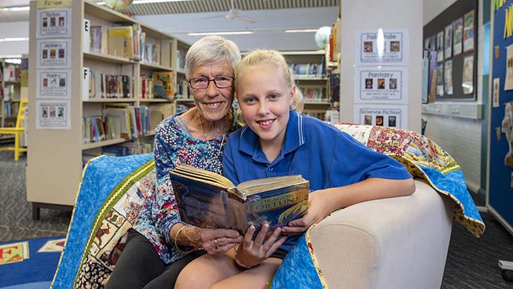 Carmel reading with her granddaughter Charlotte