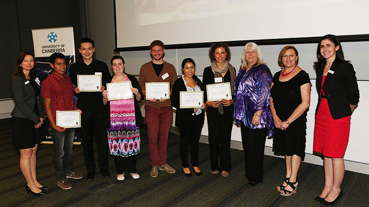 Katherine and other graduating Learning for Life students proudly showing their certificates