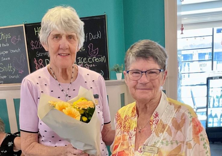 president-veronica-presents-sue-with-80th-birthday-flowers