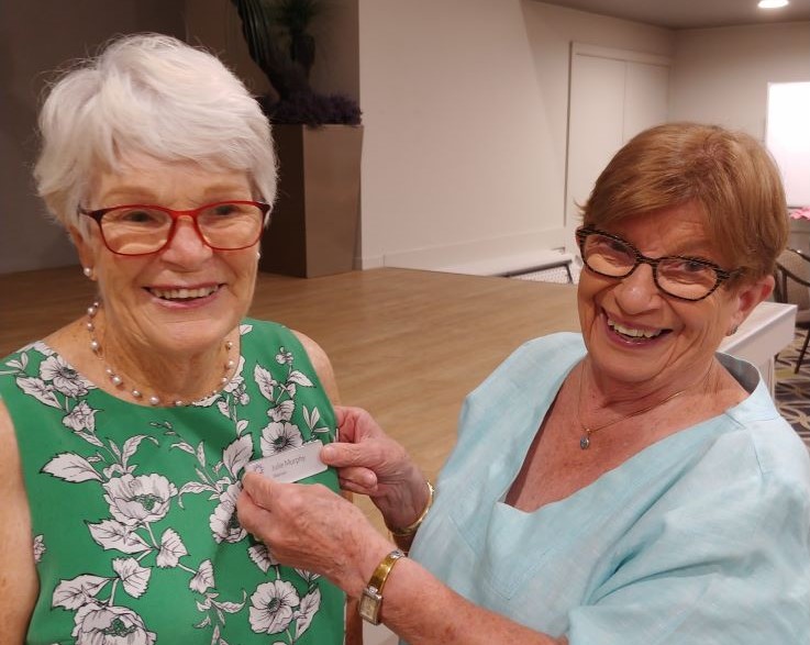 julie-receives-new-member-badge-from-president-sue