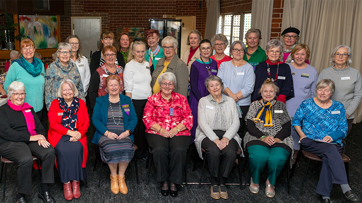 a group of VIEW club ladies all posing together outside