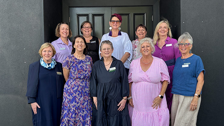 a group of women posing together