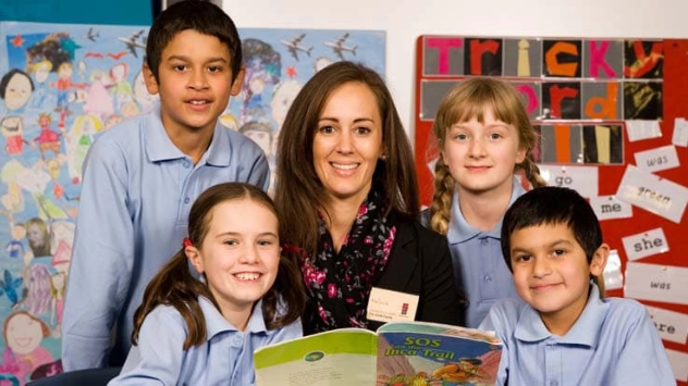 happy primary children in library